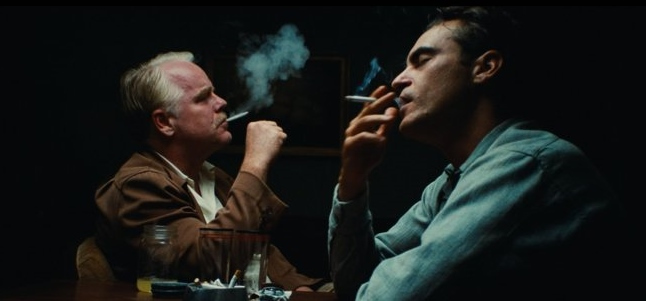 Phillip Seymour Hoffman & Joaquin Phoenix smoking in a scene from The Master